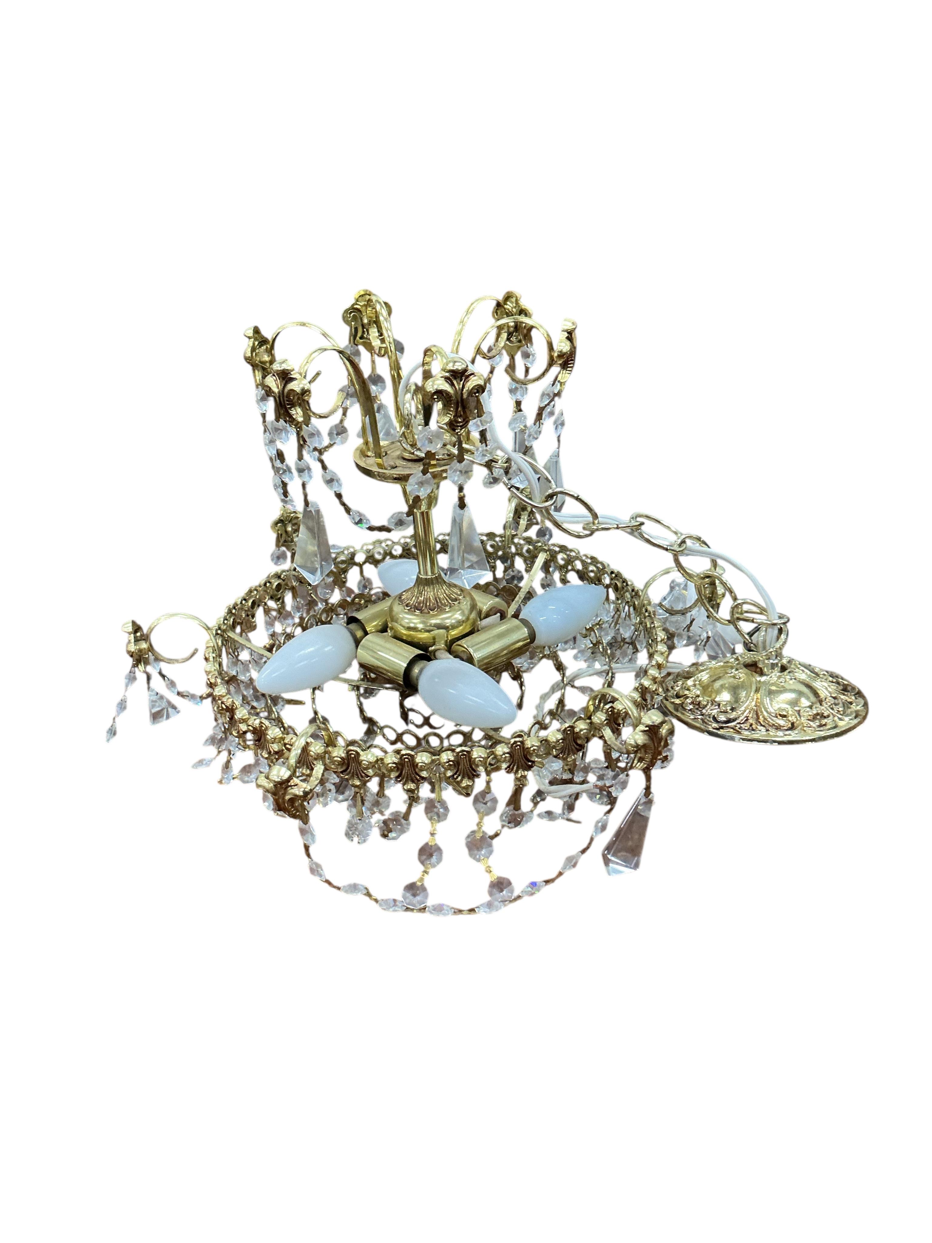 An Empire style gilt metal eight branch electrolier and two other light fittings.